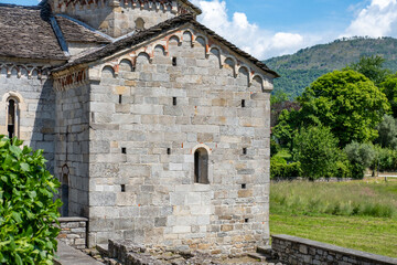 Fototapeta premium Historic Church San Giovanni Battista, stone 10th church, Picturesque Italian Montorfano village Charm, Province Verbano-Cusio-Ossola region Piedmont