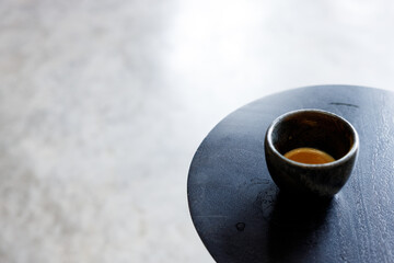 Cup of milk latte coffee on table by the street.