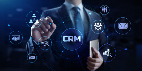 CRM Customer relationship management concept. Businessman pressing button on screen.