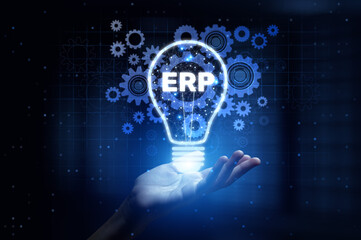 ERP Enterprise Resource Planning Integrating Business Processes for Operational Efficiency with Human Hand Holding Lamp Hologram.
