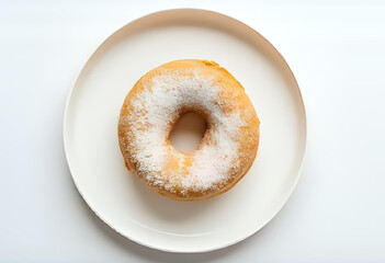 Flatlay of a classic plain donut dusted with powdered sugar, served on a white ceramic plate. Clean and soft background, suitable for bakery or dessert visuals.