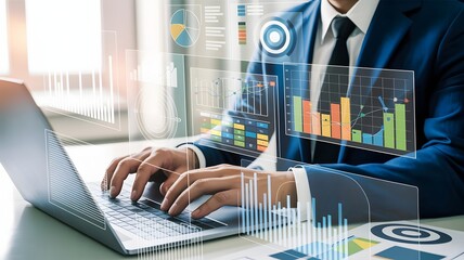 A businessman works on his laptop, surrounded by a holographic display of charts and graphs