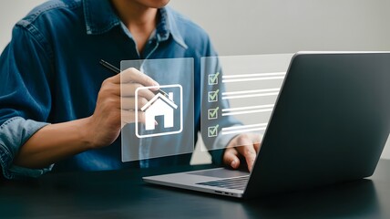 A person uses a stylus on their laptop to check off items on a real estate checklist, planning their home purchase