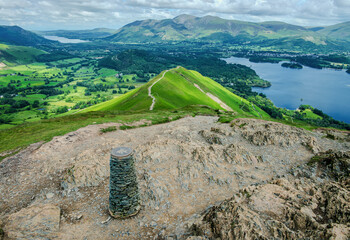Looking down from the cairn at the summit of Catbells, the ridgeline lies just below, descending...