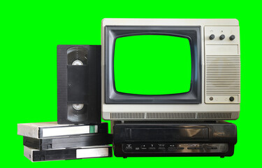 Old black vintage TV with green screen and VCR from 1980s, 1990s, 2000s isolated on green background.
