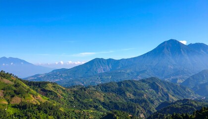 Fototapeta premium Majestic Mountain Range Under a Clear Blue Sky A Scenic Landscape