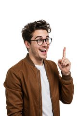 A cheerful young caucasian man in a brown bomber jacket and round black-rimmed glasses points right index finger upwards with a wide smile on a clean white background, concept of sudden inspiration