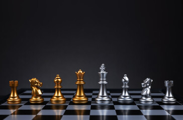 Golden and silver chess include king queen horse ship and pawn on dark background