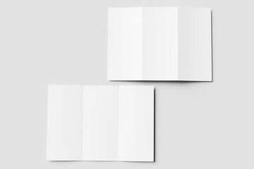 Two blank white tri-fold brochure mockups. One partially open, one closed, on a light gray surface. Ideal for design presentations or branding.