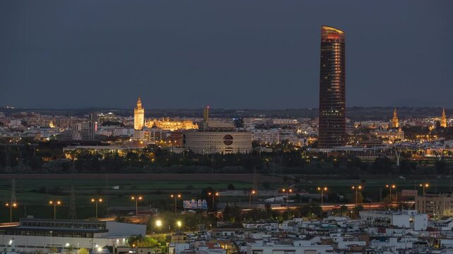 Seville Skyline Timelapse at Night with Torre Sevilla and La Giralda Illuminated