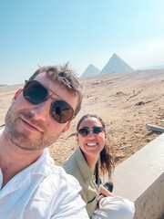 Tourists enjoying view of giza pyramids in egypt
