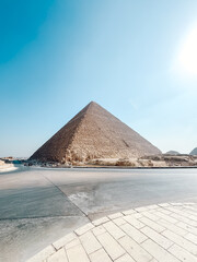 Great pyramid of giza dominating the landscape under a clear blue sky