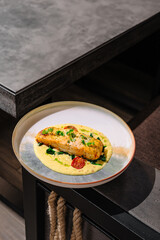 Delicious salmon dish served on a stylish plate at a modern dining table