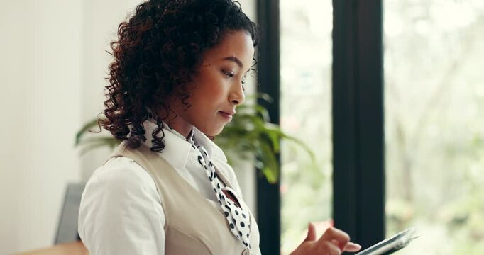 Receptionist, hotel or woman with tablet in lobby for booking schedule, check in app or reservation. Hospitality industry, concierge and typing on tech at front desk for accommodation or availability