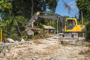dismantling, reconstruction of a concrete highway by an excavator