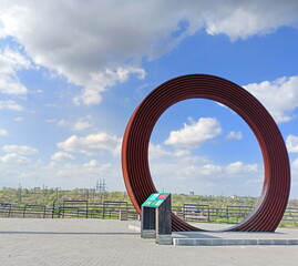 The Cossack Circle connecting the top of Unity Hill on Khortytsia and the cloudy Zaporizhzhia sky.