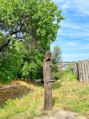 A wooden sculpture of the pagan god of fertility announces to the audience the founding of the Zaporizhzhia Sich on the glorious Khortytsia on the feast of the Protection of the Mother of God.
