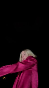 Professional dancer performing waacking at night