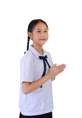Portrait of Asian student girl in primary or elementary school uniform pay respect or pray posture...