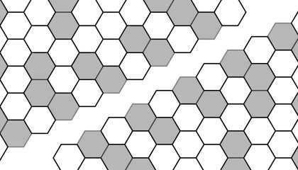 Hexagonal gray and white tiles form a modern, geometric mosaic wall pattern.