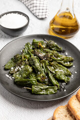 Spanish traditional food, grilled green padron pepper with salt