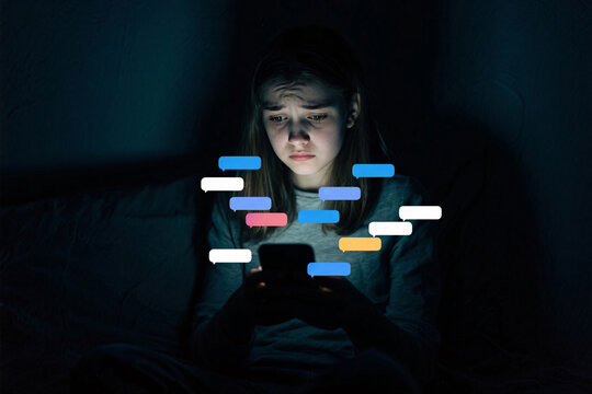 Teen girl overwhelmed by social media alerts in dark room, illuminated by phone screen, intense emotion, high contrast mood, focus on notifications and worried eyes