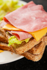 Sandwich ham, cheese, bread toast meat spam fresh delicious gourmet food background on the table rustic food top view copy space