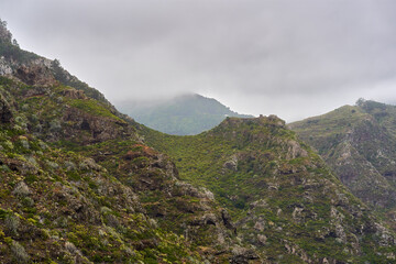 Fototapeta premium Mist over volcanic valley in Anaga