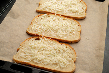 Close-up of tomato bruschetta on artisan bread slices with fresh sliced ​​tomatoes, parmesan...