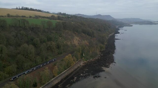 Aerial view of countryside with railway and river, United Kingdom.