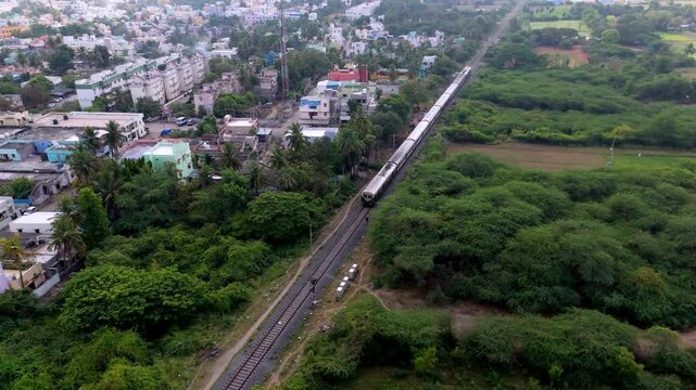 Daytime activity of Train passing at Villupuram station captured from an overhead angle