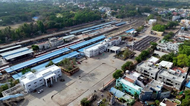 Dynamic top-down shot of Villupuram train station with morning rush