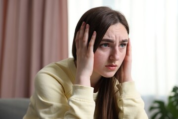 Scared woman suffering from paranoia at home