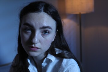 Frustrated woman suffering from insomnia at home