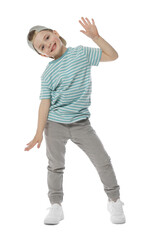 Happy little boy in baseball hat dancing on white background