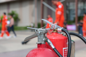 Company employees are undergoing basic fire extinguishing training, fire extinguisher use, safety week, fire prevention, loss prevention,	
