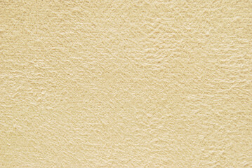 Soft beige fluffy fabric texture or background