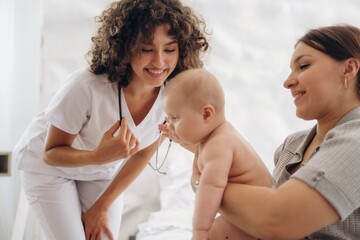 Mother with her baby girl is at doctor's appointment
