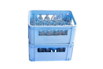 Glass clear bottles in plastic crate blue isolated on cutout PNG or transparent background....