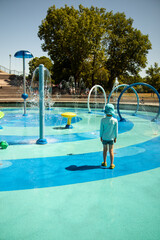 Child at a Blue and Green Splash Pad