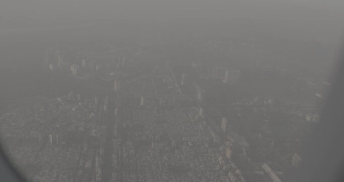 Dakc lake, Koperkhairne, Kopar Khairane, Navi Mumbai, Maharashtra, India. Mumbai Metropolitan Region. Aerial View From Airplane Window On View of the Mumbai suburb district. Evening morning sunset