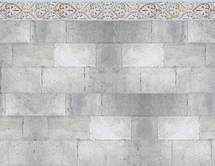 Old white stone wall with geometric molding stone eaves - image with copy space © Francesco Scatena