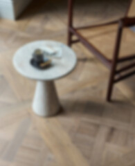 Blurred a modern neutral marble coffee table with decorative objects and a copy space.3d render, 3d illustration