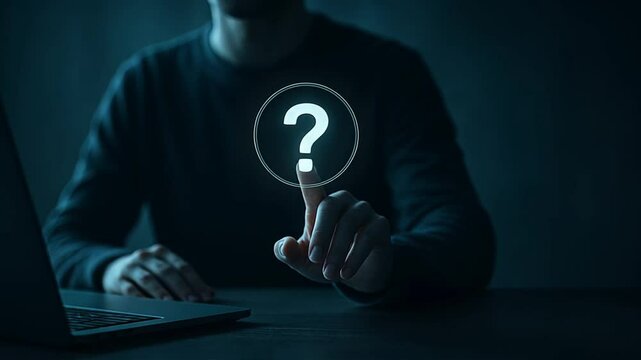 A man sitting at a desk with a laptop pointing at a floating glowing question mark, question mark, root cause analysis, question sign