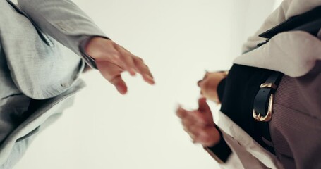 Business people, below and meeting in office for handshake, partnership and collaboration together. Accept, executive director and financial investor with proposal negotiation, promotion or teamwork - Powered by Adobe