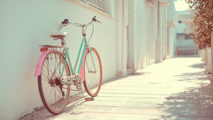 Fototapeta premium Colorful bicycle parked on a sunny morning