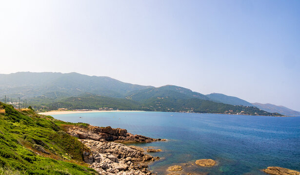 View over beach bay and green hills, Corsica, 13 June 2025