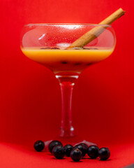glass of liqueur with berries
