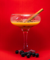 glass of liqueur with berries