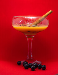 glass of liqueur with berries
